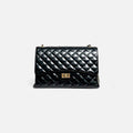Bolso acolchado Maxi clasic negro de piel de vacuno con cadena y cierre giratorio