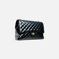 Bolso acolchado maxi clásico negro de piel con cadena y cierre giratorio
