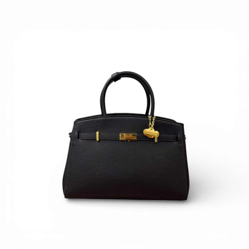 Diábolo Lux Midi bolso negro de piel vacuno premium con herrajes dorados y doble asa rígida.