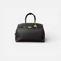 Bolso Diábolo negro de piel vacuno premium con diseño estructurado y herrajes dorados.