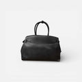 Bolso Diábolo negro de piel vacuno premium con diseño estructurado y herrajes dorados.