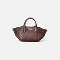 Bolso de mano burdeos – Elegancia atemporal en piel de vacuno con herrajes dorados
