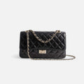 Bolso acolchado negro clásico de piel con cadena dorada elegante y atemporal