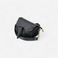 Bolso silla de montar negro de piel con doble correa y herrajes dorados