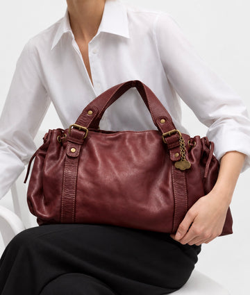 Bolso mano rock piel lavada burdeos